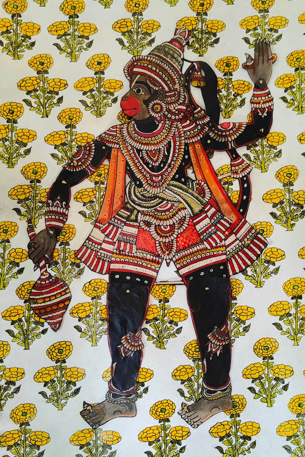 a beautiful handcrafted puppet of Lord Hanuman stitched on a handpainhed background