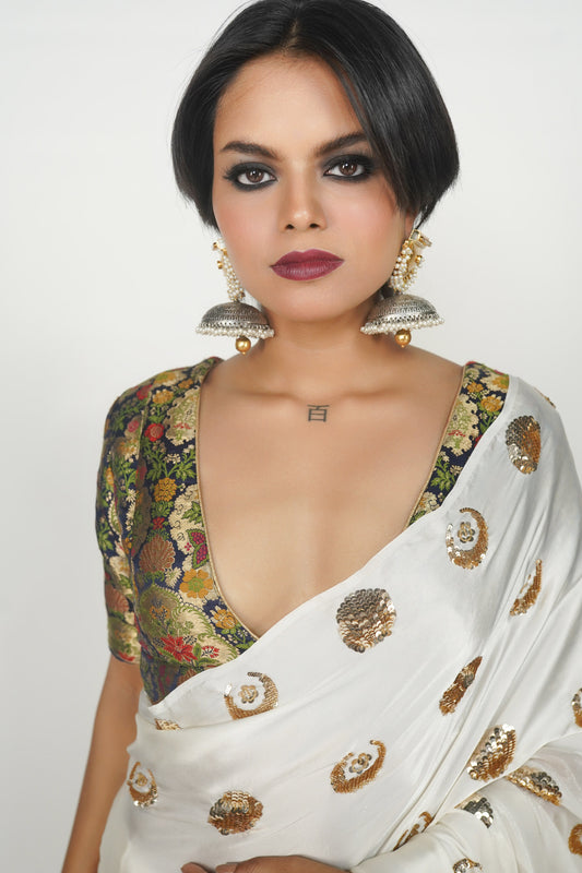 White and gold embroidered silk saree