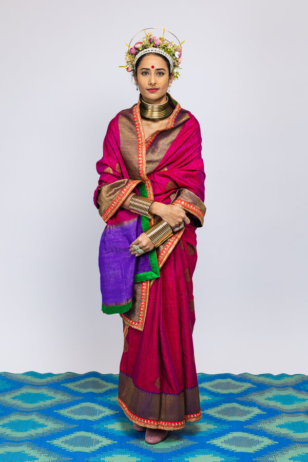 A woman wearing a beautiful handwoven benarsi silk saree designed by designer Ayush Kejriwal.
