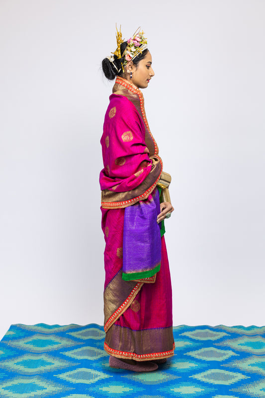A woman wearing a beautiful handwoven benarsi silk saree designed by designer Ayush Kejriwal.