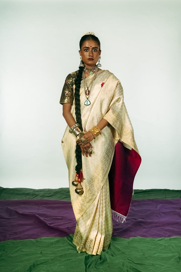 A woman dressed in a hand woven benarsi silk saree designed by Ayush Kejriwal.