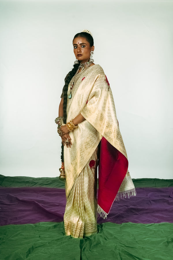 A woman dressed in a hand woven benarsi silk saree designed by Ayush Kejriwal.