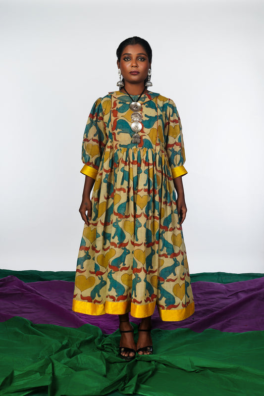 A woman wearing a hand painted pen kalamkari dress designed by Ayush Kejriwal.