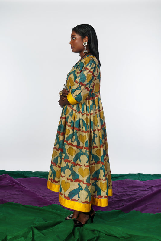 A woman wearing a hand painted pen kalamkari dress designed by Ayush Kejriwal.