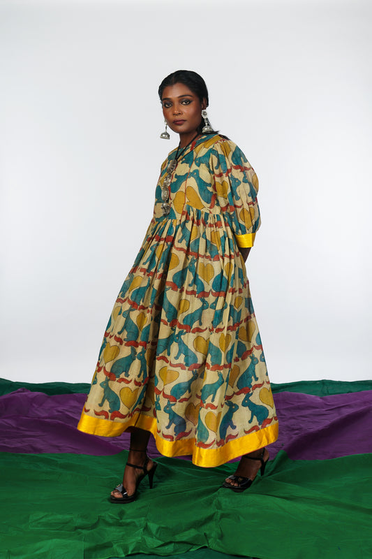 A woman wearing a hand painted pen kalamkari dress designed by Ayush Kejriwal.