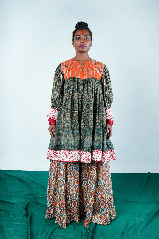 A woman wearing a Kurta and Plazo set designed by Designer Ayush Kejriwal.