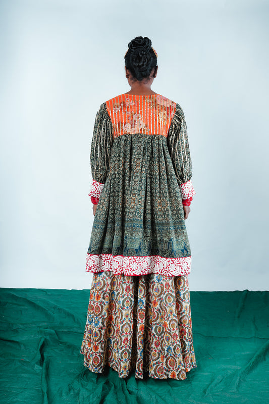 A woman wearing a Kurta and Plazo set designed by Designer Ayush Kejriwal.