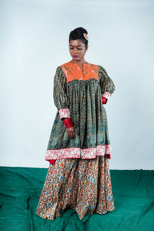 A woman wearing a Kurta and Plazo set designed by Designer Ayush Kejriwal.