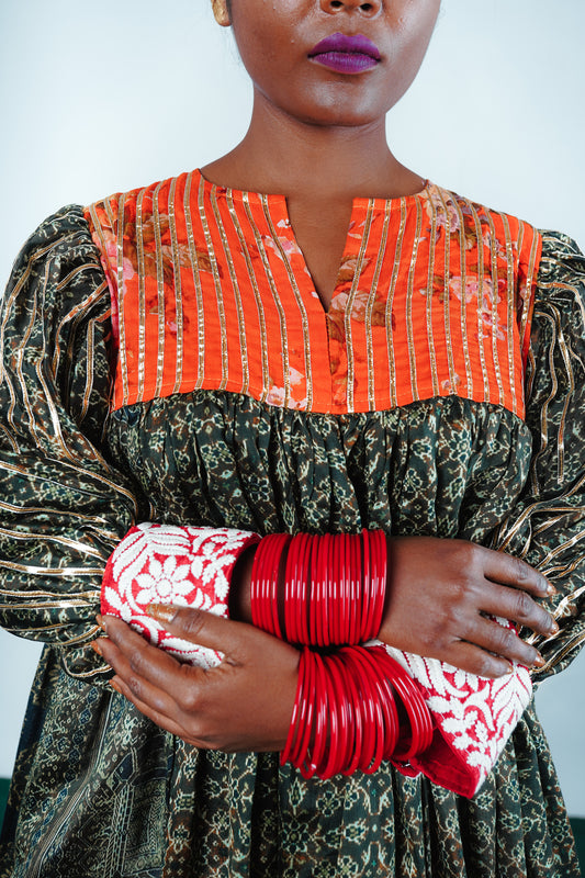 A woman wearing a Kurta and Plazo set designed by Designer Ayush Kejriwal.