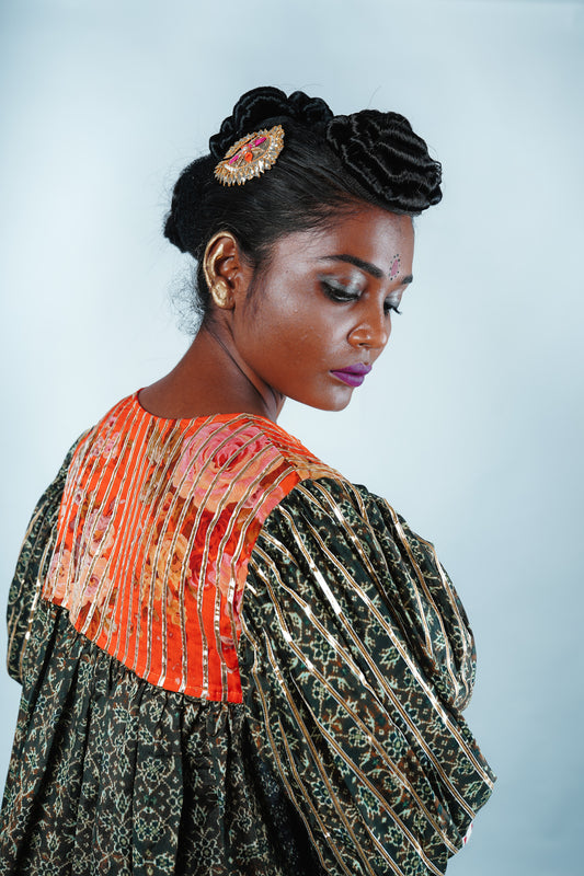 A woman wearing a Kurta and Plazo set designed by Designer Ayush Kejriwal.