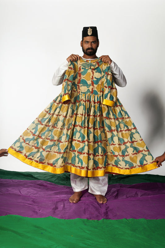 A woman wearing a hand painted pen kalamkari dress designed by Ayush Kejriwal.