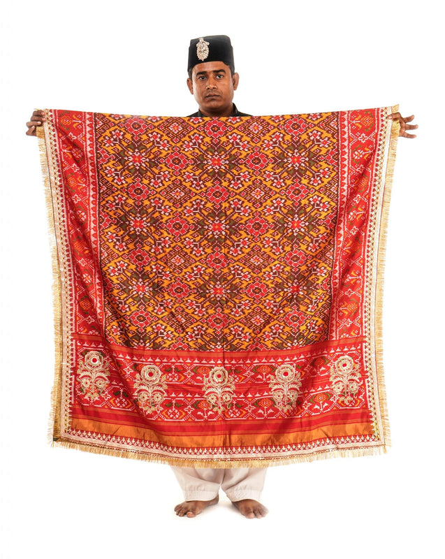 A women wearing a hand woven patola silk dupatta designed by Ayush Kejriwal.