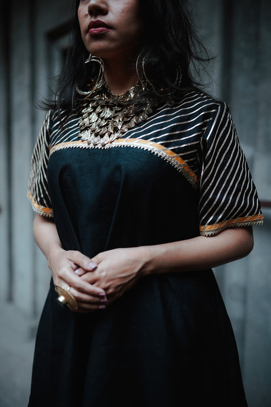A woman wearing an Indian Ethnic Wedding Kurta and Pant (salwar kameez) set designed by Ayush Kejriwal.