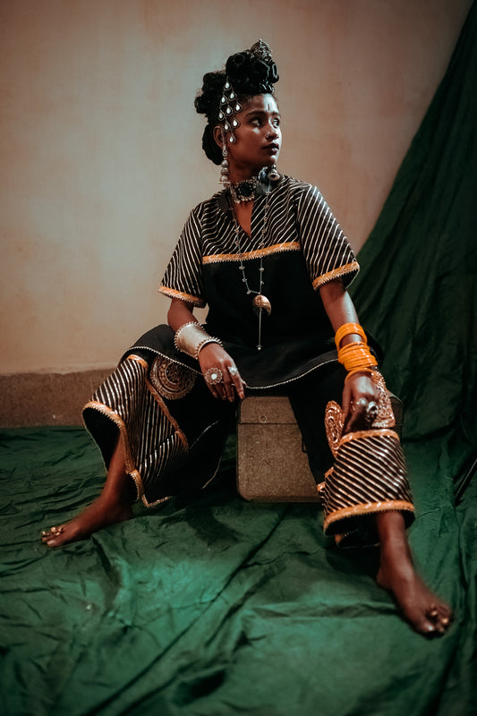 A woman wearing an Indian Ethnic Wedding Kurta and Pant (salwar kameez) set designed by Ayush Kejriwal.