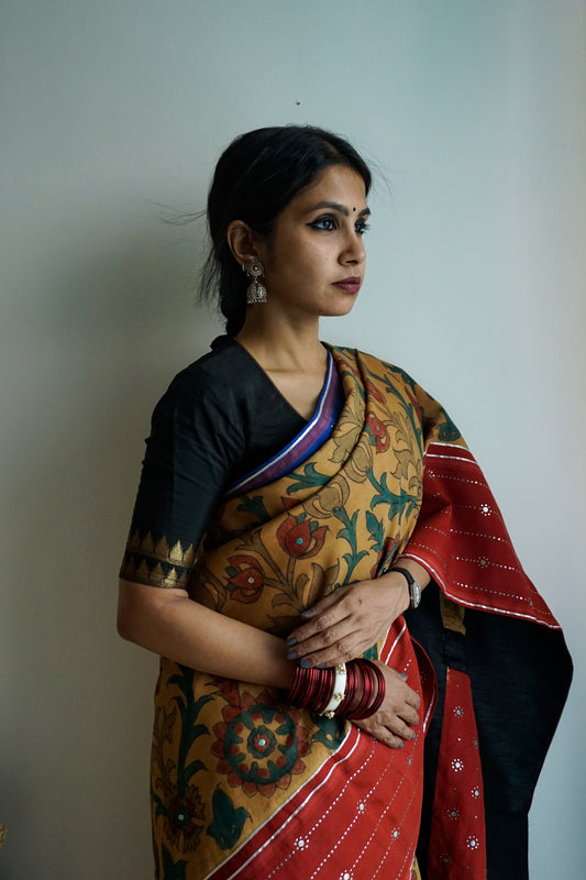 Hand painted pen Kalamkari saree on a handwoven kanjiveram silk base