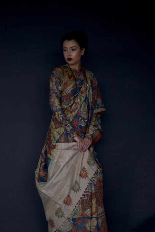 A woman wearing an authentic handmade pen Kalamkari saree designed by Ayush Kejriwal.