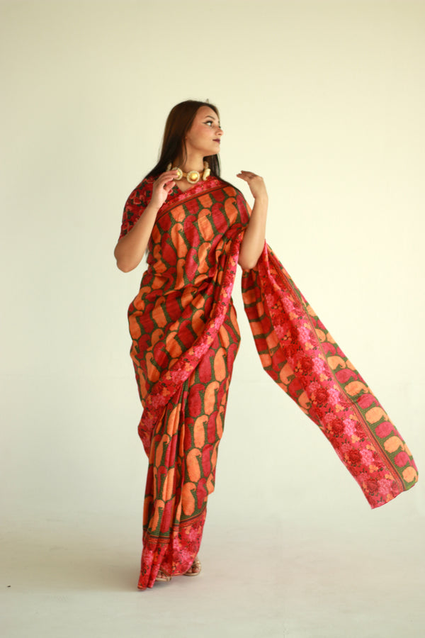 A woman wearing a printed silk saree designed by Ayush Kejriwal.