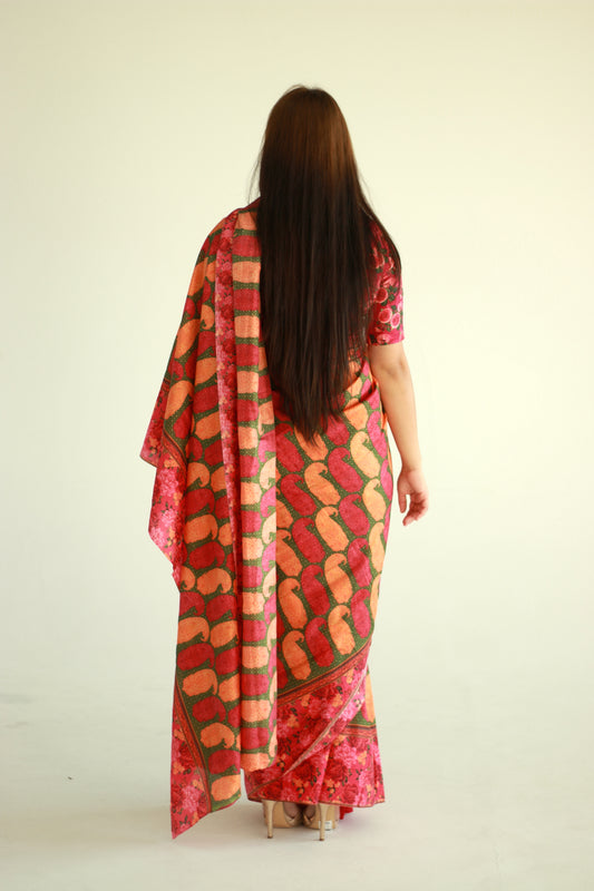 A woman wearing a printed silk saree designed by Ayush Kejriwal.
