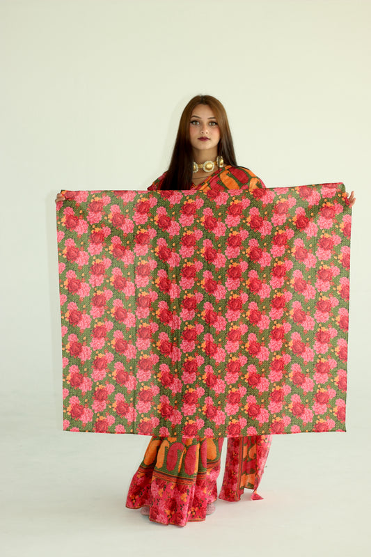 A woman wearing a printed silk saree designed by Ayush Kejriwal.