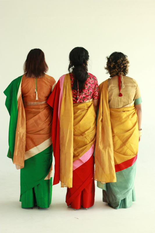A women wearing a golden chanderi silk saree designed by Ayush Kejriwal.