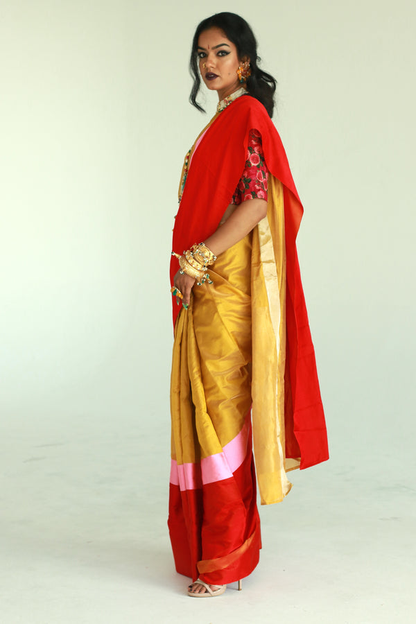 A women wearing a golden chanderi silk saree designed by Ayush Kejriwal.