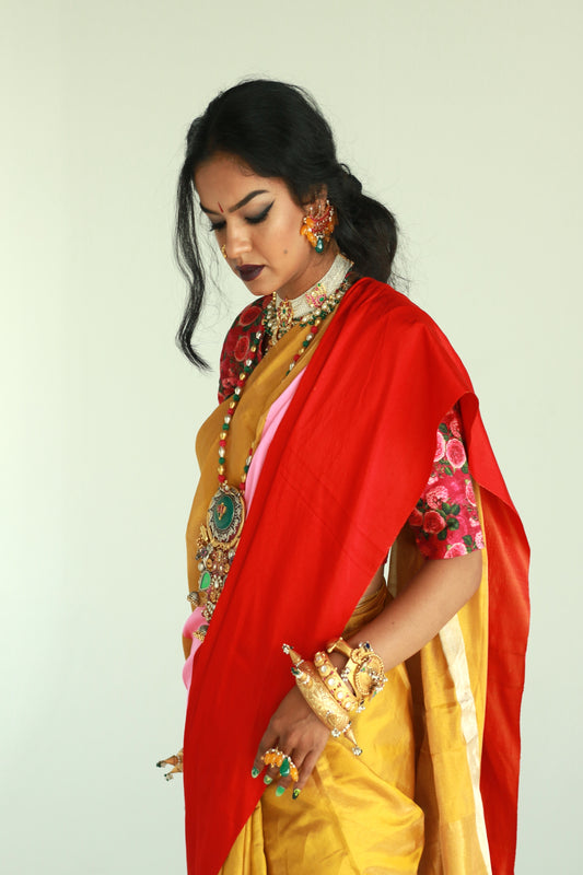 A women wearing a golden chanderi silk saree designed by Ayush Kejriwal.