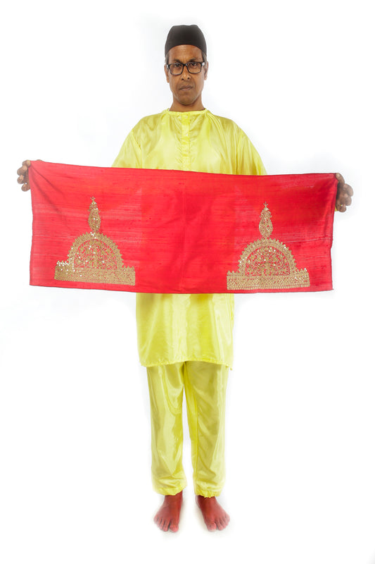 A woman wearing a red embroidered wedding saree designed by Ayush Kejriwal.