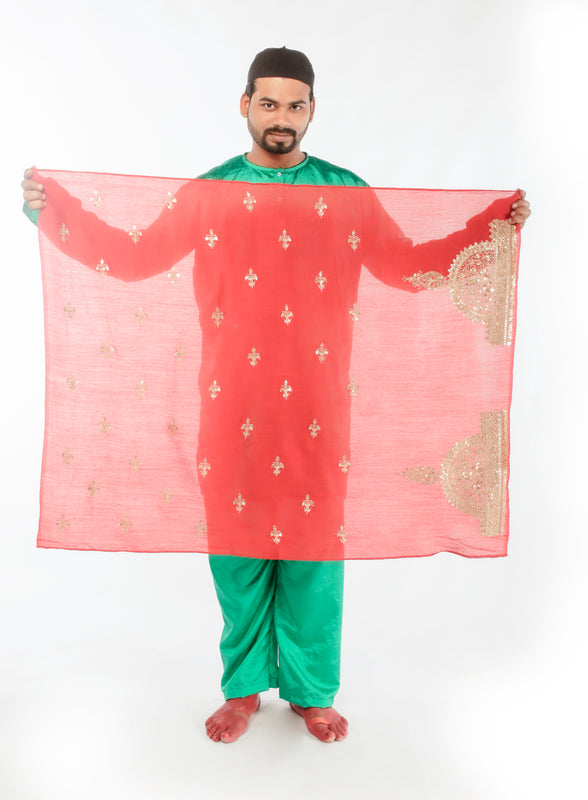 A woman wearing a red embroidered wedding saree designed by Ayush Kejriwal.