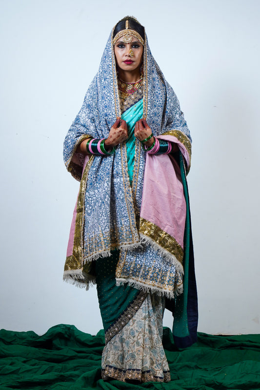 A heritage, luxurious , handwoven and handembroidered one of a kind heirloom pashmina with kashmiri hand embroidery and an embroidered edging.