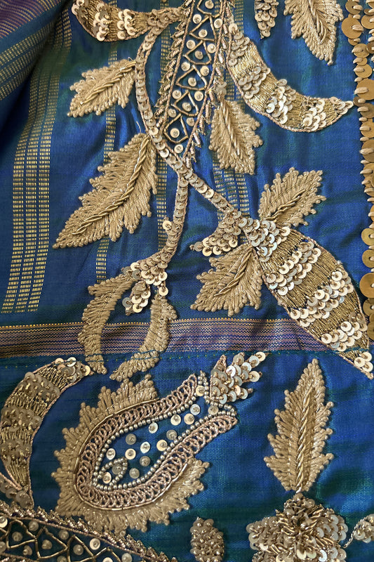 Close-up of blue kanjiveeram silk saree with intricate gold embroidery