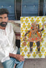 a beautiful handcrafted puppet of Lord Hanuman stitched on a handpainhed background