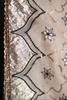 an hand embroidered organza silk sareewith intricate patterns and embellishments