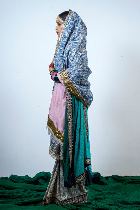 A heritage, luxurious , handwoven and handembroidered one of a kind heirloom pashmina with kashmiri hand embroidery and an embroidered edging.