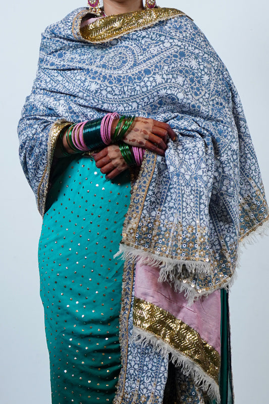 A heritage, luxurious , handwoven and handembroidered one of a kind heirloom pashmina with kashmiri hand embroidery and an embroidered edging.