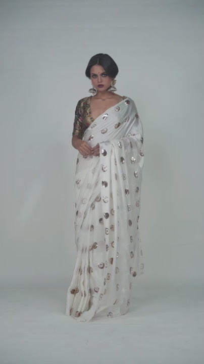 Handembroidered white and gold party wear saree