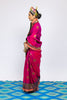 A woman wearing a beautiful handwoven benarsi silk saree designed by designer Ayush Kejriwal.