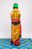 A woman wearing a yellow handwoven Cora benarsi silk saree designed by Ayush Kejriwal.