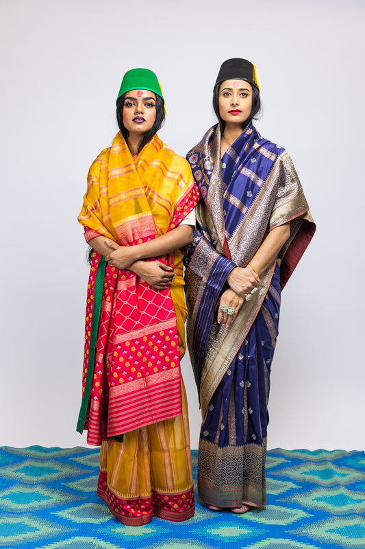 Two women wearing handwoven Cora benarsi silk sarees designed by Ayush Kejriwal.