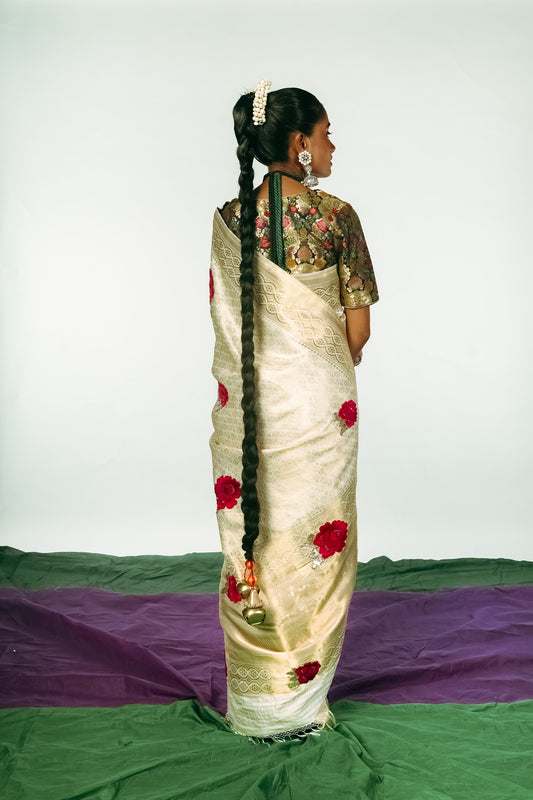 A woman dressed in a hand woven benarsi silk saree designed by Ayush Kejriwal.