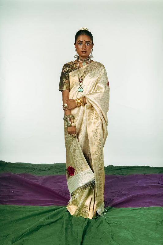 A woman dressed in a hand woven benarsi silk saree designed by Ayush Kejriwal.