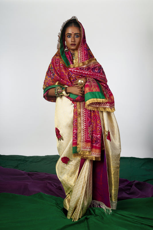 A women wearing a hand woven patola silk dupatta designed by Ayush Kejriwal.