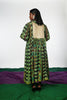 A woman wearing a hand painted pen kalamkari dress designed by Ayush Kejriwal.