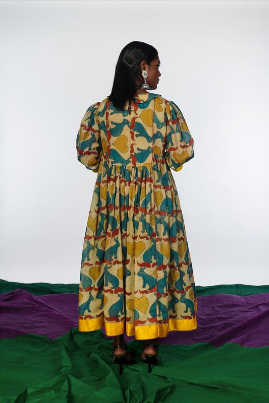 A woman wearing a hand painted pen kalamkari dress designed by Ayush Kejriwal.
