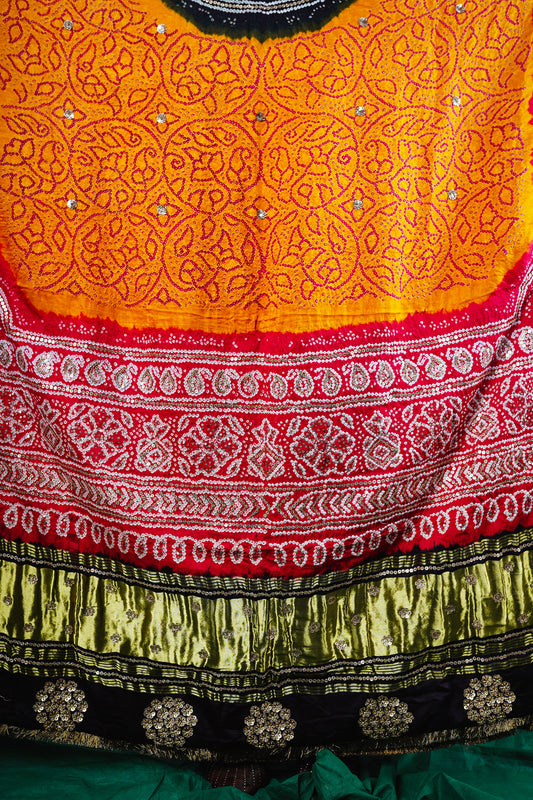 Hand embroidery details of an Indian wedding bandhani dupatta designed by Ayush Kejriwal.