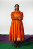 Orange silk frock by Ayush Kejriwal.