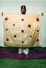 A man showing a hand woven benarsi silk saree designed by Ayush Kejriwal.