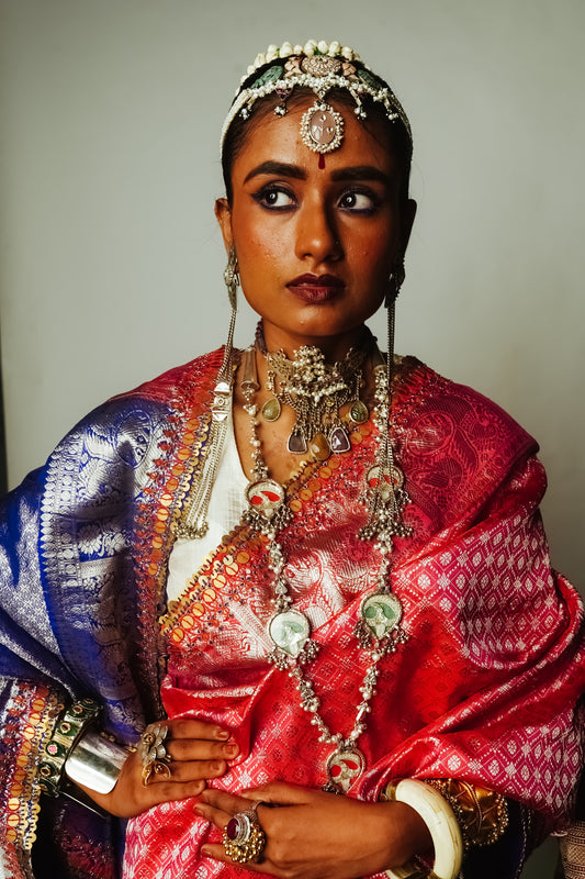 Kanjiveram silk saree styled with silver jewellery.