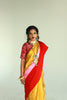 A women wearing a golden chanderi silk saree designed by Ayush Kejriwal.