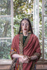 A woman wearing a handcrafted real patan patola saree designed by Ayush Kejriwal.